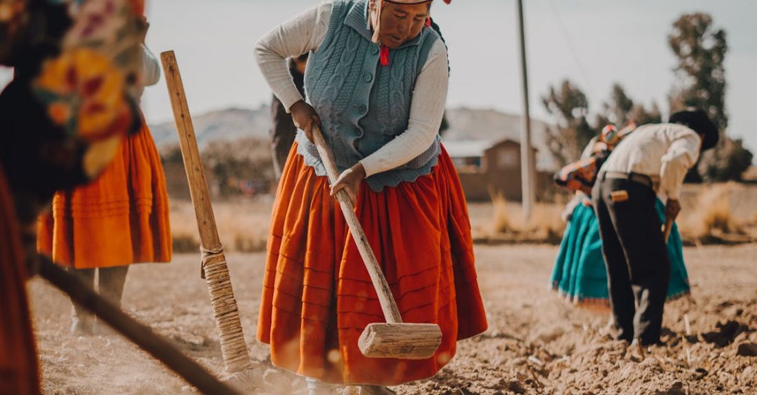 Farming Tools - Women in Traditional Clothing Working in Field