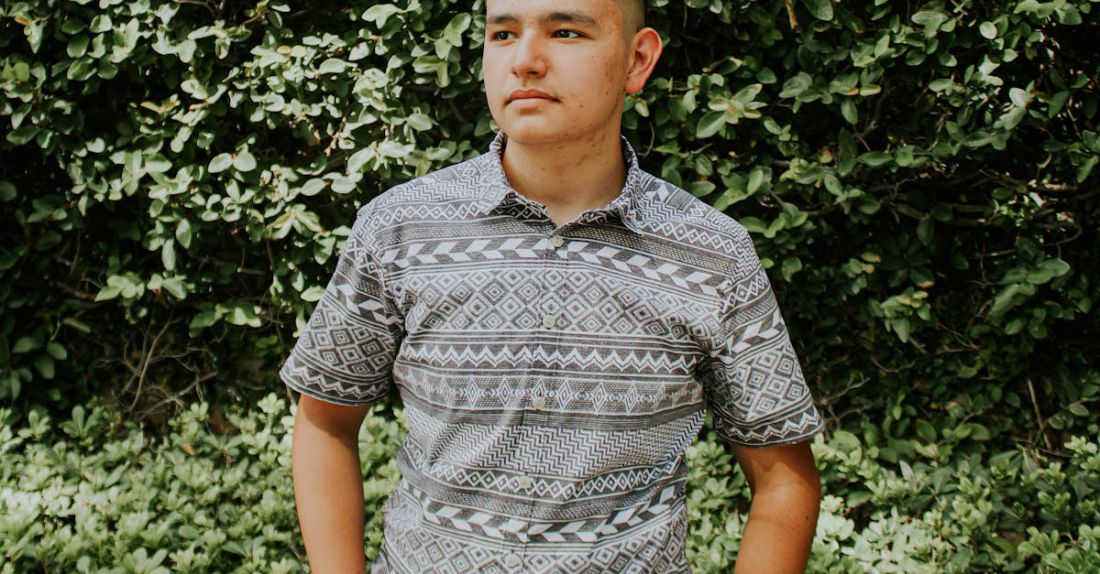Pocket Parks - Serious male standing near green bush